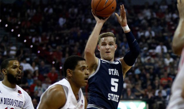 Sam Merrill #5 of the Utah State Aggies passes the ball during the championship game of the Mountai...
