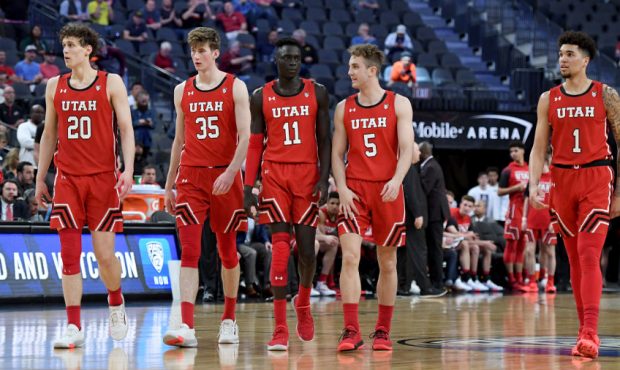 Utah men's basketball team takes the floor...