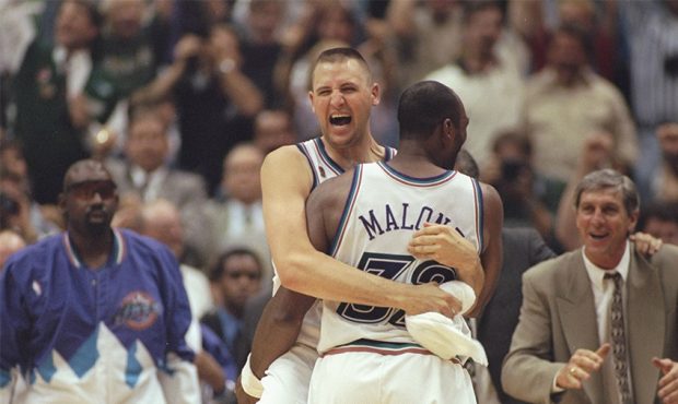 8 Jun 1997: Karl Malone of the Utah Jazz celebrates with teammate Greg Ostertag as head coach Jerry...