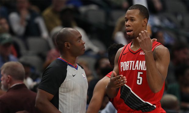 DALLAS, TEXAS - OCTOBER 27: Rodney Hood #5 of the Portland Trail Blazers talks with NBA official Co...
