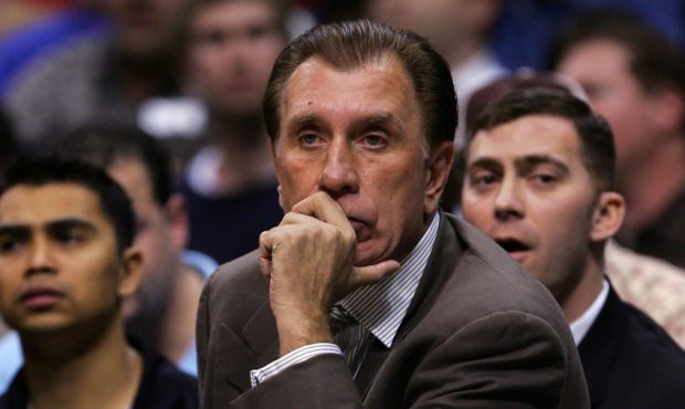 Head coach Rudy Tomjanovich with Mike Wells (Photo by Lisa Blumenfeld/Getty Images)...