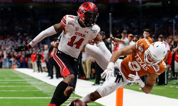 Josh Nurse #14 of the Utah Utes breaks up a pass intended for Collin Johnson #9 of the Texas Longho...