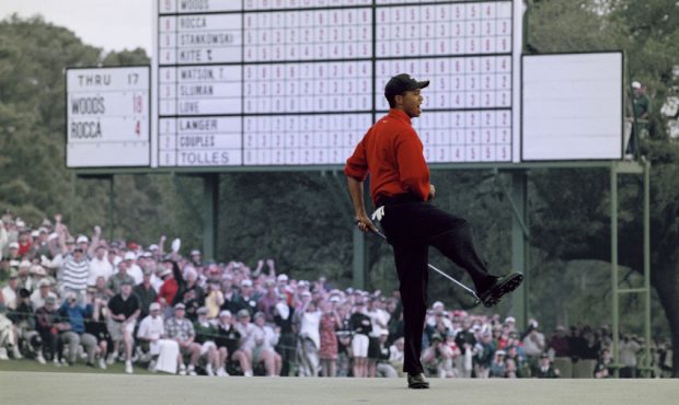 Tiger Woods of the United States celebrates after sinking a 4 feet putt to win the US Masters Golf ...