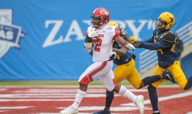 Utah Utes running back Zack Moss (2) crosses the goal line for a touchdown during the Zaxby's Heart...