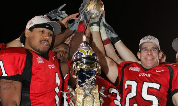 Utah players celebrates by the trophy. The Utes won the Fiesta Bowl 35 - 7 against the Pittsburgh P...