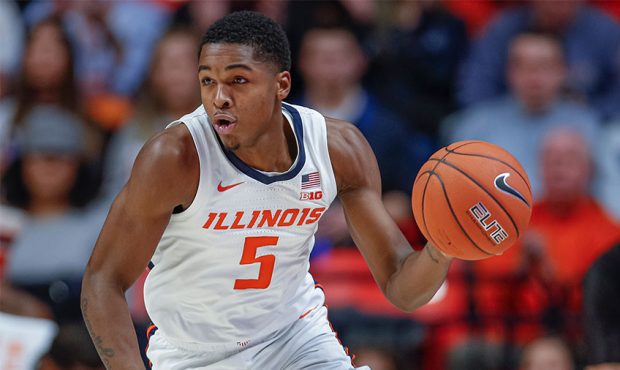 Tevian Jones #5 of the Illinois Fighting Illini brings the ball up court during the game against th...