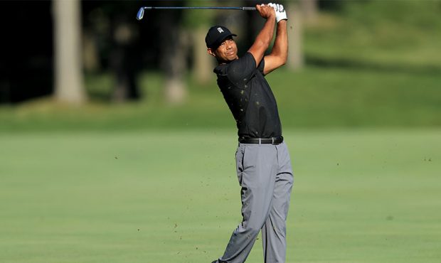 Tiger Woods plays a shot during a practice round prior to The Memorial Tournament at Muirfield Vill...