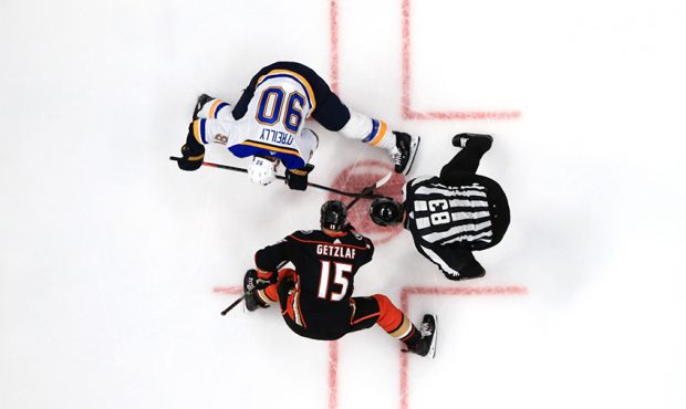 Ryan Getzlaf #15 of the Anaheim Ducks faces off with Ryan O'Reilly #90 of the St. Louis Blues as li...