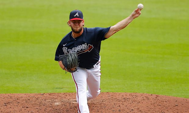 A.J. Minter #33 of the Atlanta Braves pitches during summer workouts at Truist Park on July 09, 202...