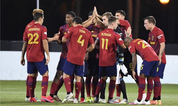 Players of Real Salt Lake huddle before a round of 16 match of the MLS Is Back Tournament between S...