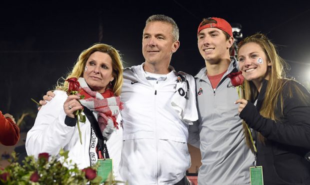 Ohio State head coach Urban Meyer poses for a photo with his family while celebrating the victory d...