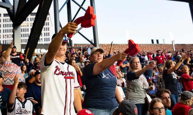 ATLANTA, GA - OCTOBER 9: Fans perform the tomahawk chant during Game Five of the National League Di...