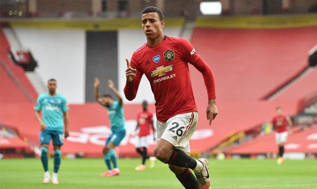 MANCHESTER, ENGLAND - JULY 04: Mason Greenwood of Manchester United celebrates after scoring his te...
