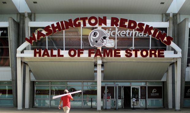 LANDOVER, MARYLAND - JULY 13: A worker carries building materials into the Hall of Fame Store at Fe...