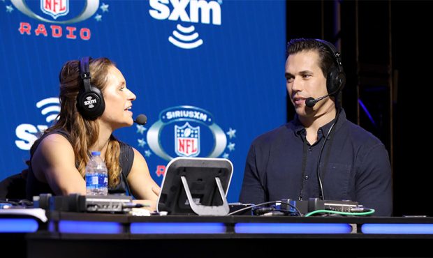 Football coach, Jennifer Welter (L) and SiriusXM Host Brady Quinn speak onstage during day one with...