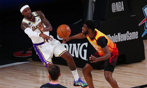 Kentavious Caldwell-Pope #1 of the Los Angeles Lakers passes the ball against Emmanuel Mudiay #15 o...