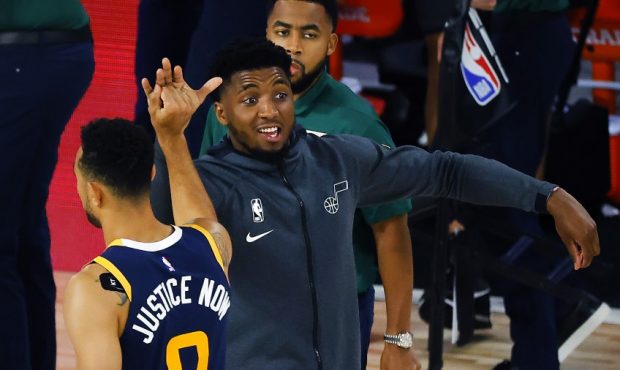 Donovan Mitchell high fives Nigel Williams-Goss (Photo by Kevin C. Cox/Getty Images)...