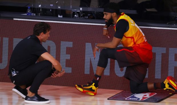 Mike Conley of the Utah Jazz talks to coach Quin Snyder (Photo by Kevin C. Cox/Getty Images)...