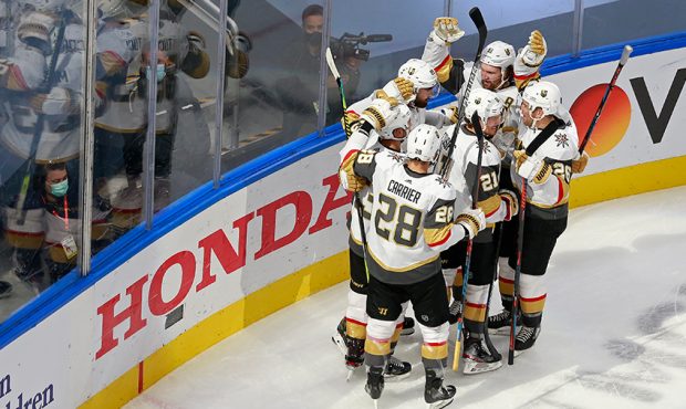 Alex Tuch #89 of the Vegas Golden Knights is congratulated by his teammates after scoring the game-...