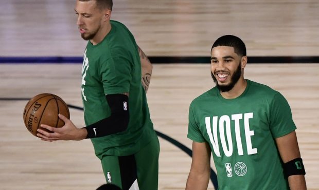 Jayson Tatum and Daniel Theis warmup in vote shooting shirts (Photo by Douglas P. DeFelice/Getty Im...
