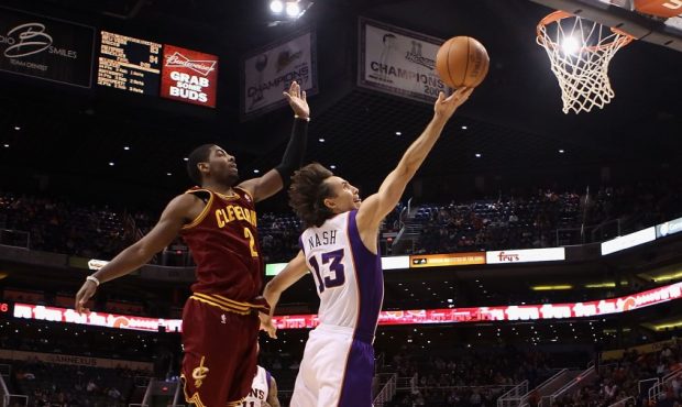Steve Nash scores against Kyrie Irving (Photo by Christian Petersen/Getty Images)...