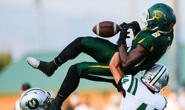 Kearns wide receiver Jeff Bassa (2) nearly catches a ball during a high school football game agains...