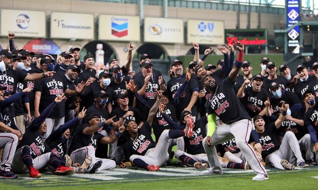Atlanta Braves players celebrate on field after winning Game 3 of the NLDS between the Atlanta Brav...