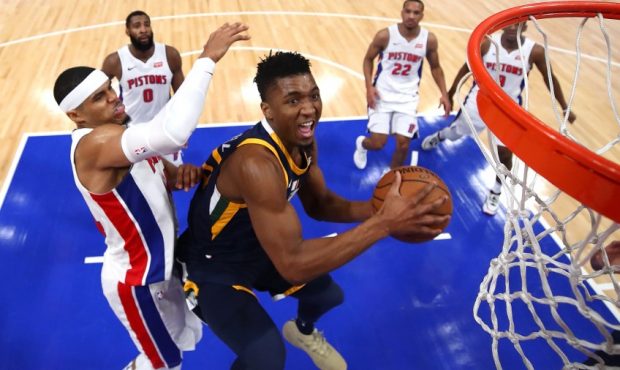 Donovan Mitchell goes up for a layup against Philadelphia 76ers forward Tobias Harris (Photo by Gre...