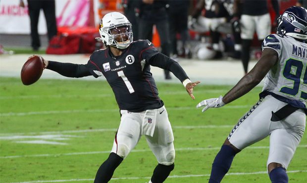 Quarterback Kyler Murray #1 of the Arizona Cardinals throws the ball away on fourth and three as de...