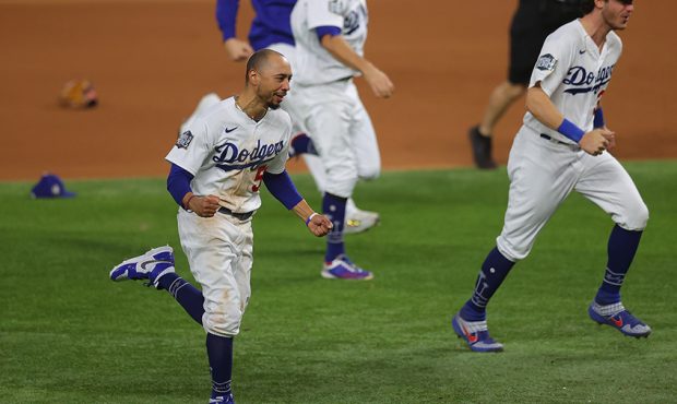 Mookie Betts #50 of the Los Angeles Dodgers celebrates after defeating the Tampa Bay Rays 3-1 in Ga...