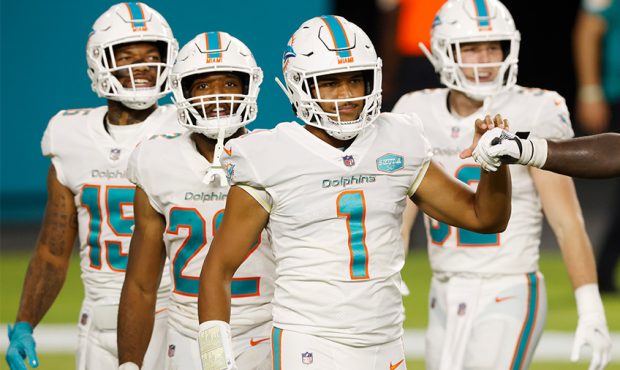 Tua Tagovailoa #1 of the Miami Dolphins reacts against the New York Jets during the fourth quarter ...
