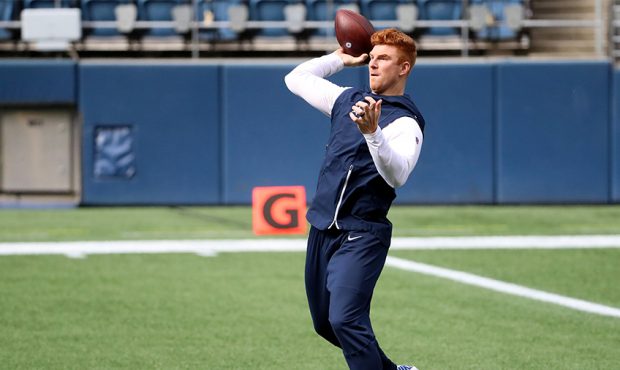 SEATTLE, WASHINGTON - SEPTEMBER 27: Andy Dalton #14 of the Dallas Cowboys warms up prior to the gam...