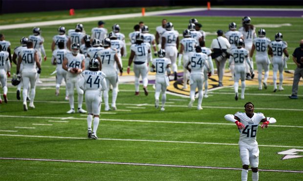 Joshua Kalu #46 of the Tennessee Titans and his teammates take the field before the game against th...