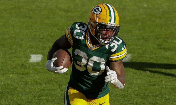 Jamaal Williams #30 of the Green Bay Packers runs with the ball in the third quarter against the Mi...