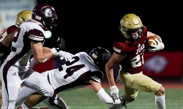 Juab’s Dawson Olsen avoids the tackle from Morgan’s Isaac Rees in the 3A football championship ...