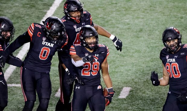 Utah Utes linebacker Nephi Sewell (29) celebrates with teammates after he intercepted a pass during...