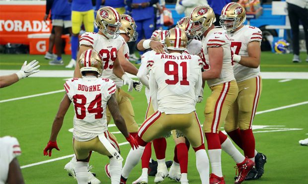 Robbie Gould #9 of the San Francisco 49ers celebrates with teammates after making a game-winning fi...
