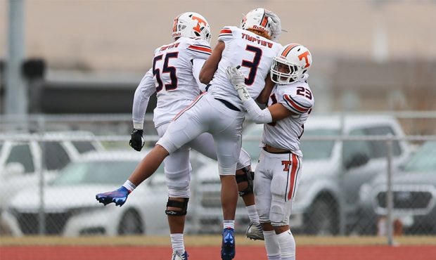 Timpview players celebrate after Timpview cornerback Raider Damuni (3) returns a fumble for a touch...