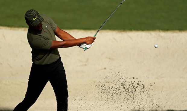 Tony Finau of the United States plays his shot out of a bunker on the tenth hole during the first r...