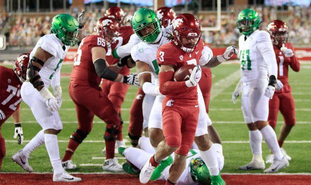 Deon McIntosh #3 of the Washington State Cougars scores a touchdown against the Oregon Ducks in the...