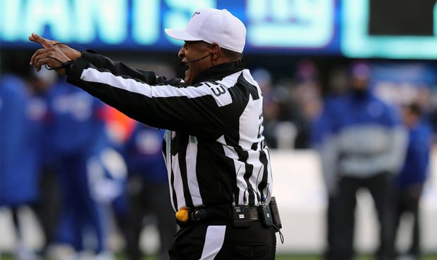 EAST RUTHERFORD, NEW JERSEY - DECEMBER 15: Referee Jerome Boger #23 officiates during the game betw...
