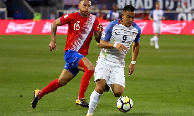 Bobby Wood #9 of the United States controls the ball against Francisco Calvo #15 of Costa Rica duri...