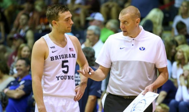 Jake Toolson and BYU coach Mark Pope (Photo by Darryl Oumi/Getty Images)...
