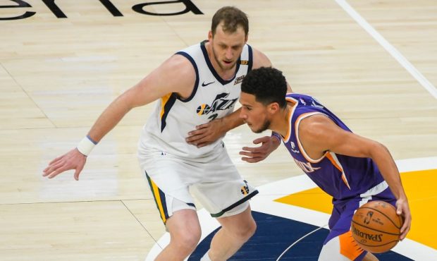 Utah Jazz guard Joe Ingles defends Phoenix Suns guard Devin Booker (Photo by Alex Goodlett/Getty Im...