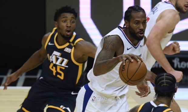 Utah Jazz guard Donovan Mitchell chases Los Angeles Clippers forward Kawhi Leonard (Photo by Harry ...