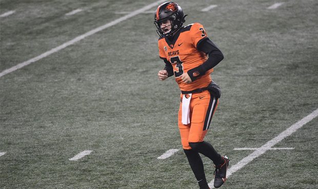 Quarterback Tristan Gebbia #3 of the Oregon State Beavers hobbles off the field during the second h...