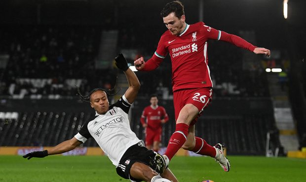 LONDON, ENGLAND - DECEMBER 13: Andrew Robertson of Liverpool is tackled by Bobby Decordova-Reid of ...