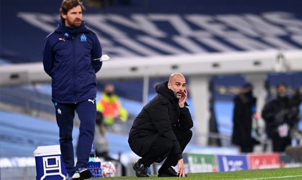 MANCHESTER, ENGLAND - DECEMBER 09: Pep Guardiola, Manager of Manchester City looks on during the UE...