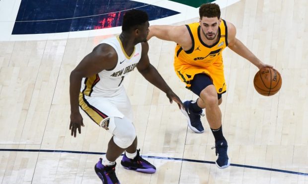 Georges Niang of the Utah Jazz defended by New Orleans Pelians forward Zion Williamson (Photo by Al...