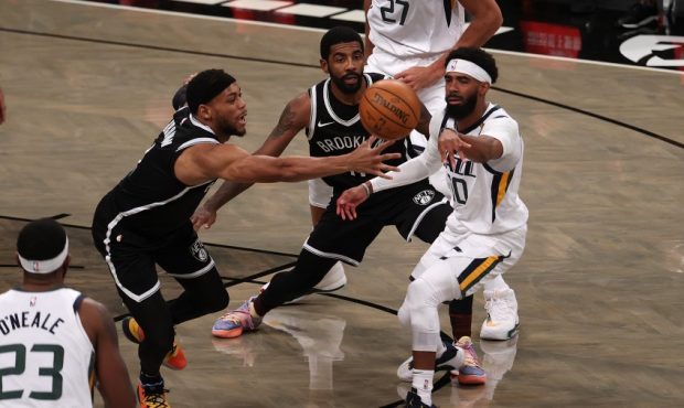 Mike Conley of the Utah Jazz passes against the Brooklyn Nets (Photo by Al Bello/Getty Images)...